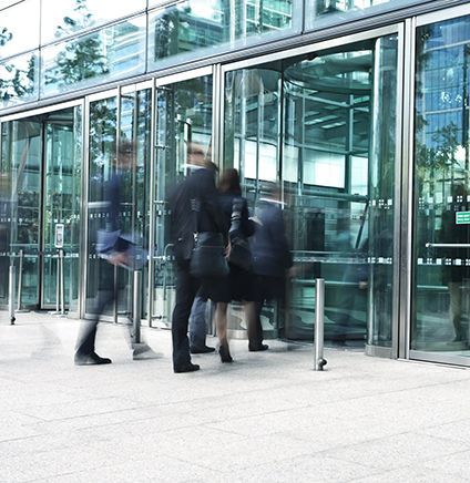Group of business people walking in a financial district, long exposure
